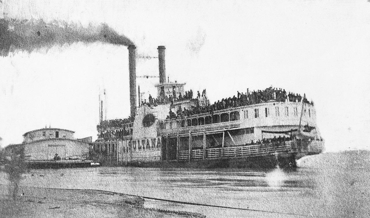 Faded photograph of the overcrowded paddlewheel steamboat Sultana before her ill-fated journey. Faded photograph of the overcrowded paddlewheel steamboat Sultana before her ill-fated journey.